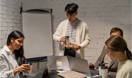 Team discussing a website project around a table