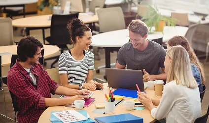 Team planning work together at a table